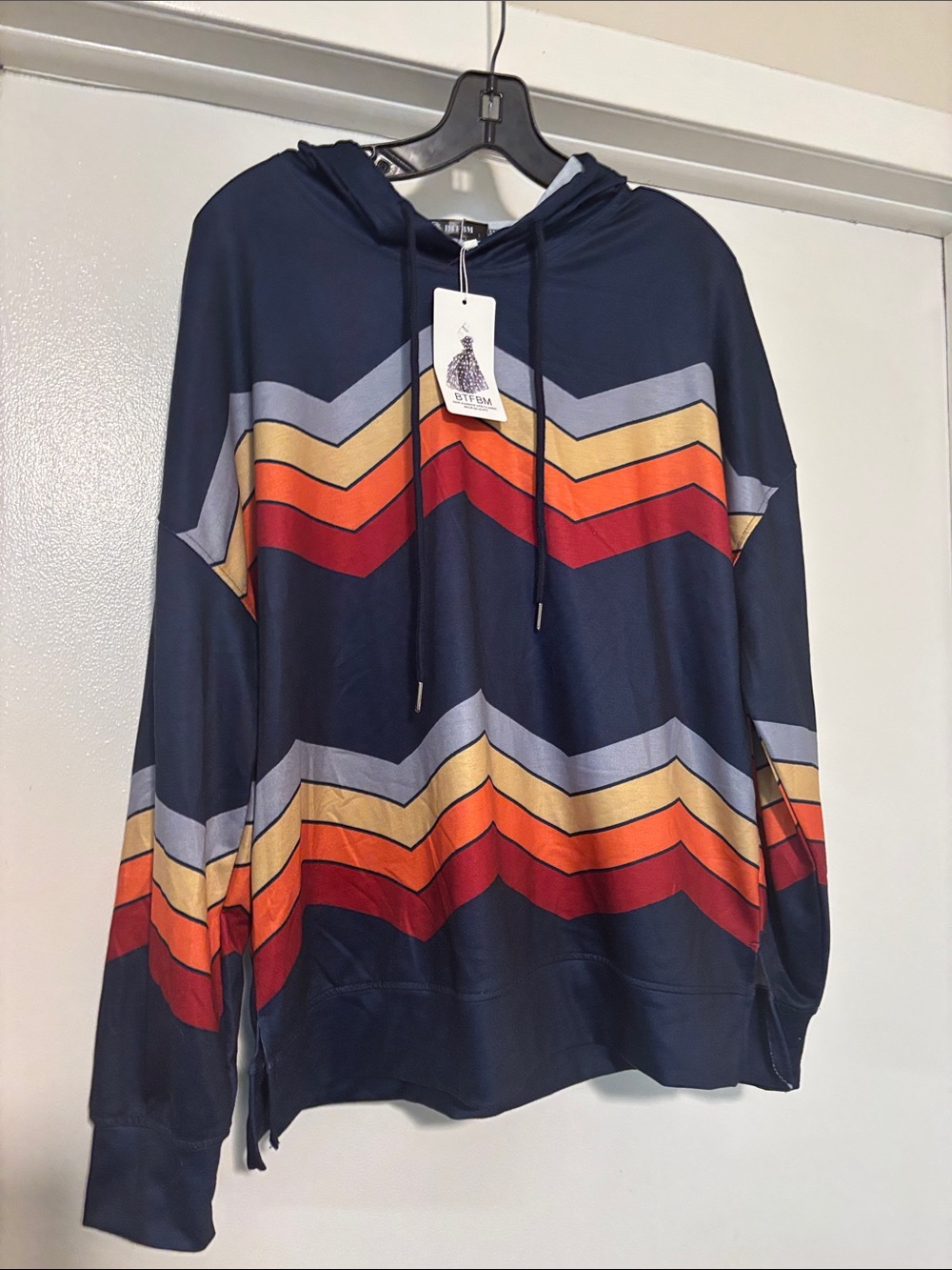 Navy Chevron Stripe Hoodie with Orange & Red Accents